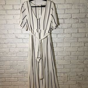 Unique short, jumpsuit with long skirt.